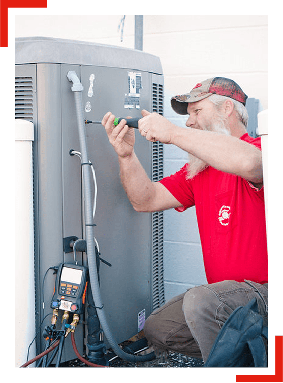 Comfort Control employee working on an outside HVAC unit